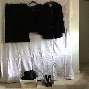 Three piece ladies skit and jacket with camisole.